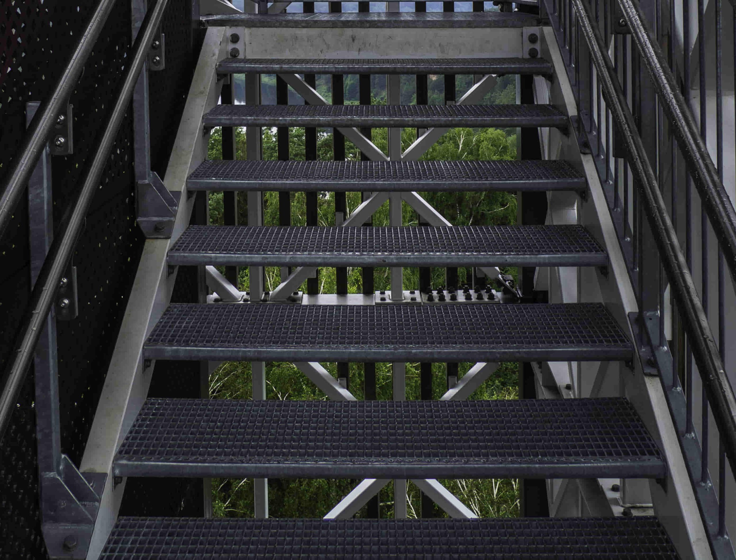 modern steel stair fabrication with steel railing fall protection